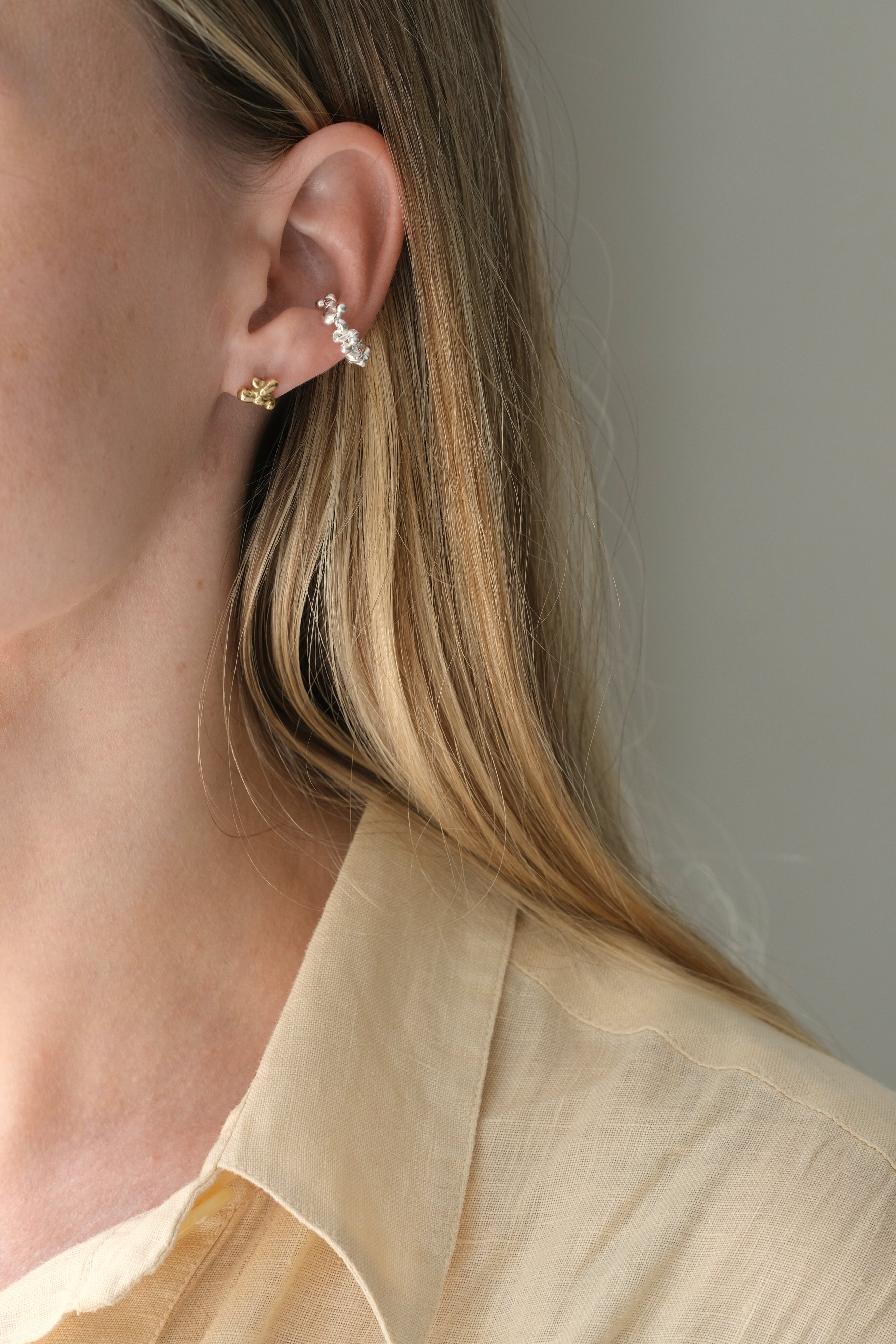 Handmade DROP 03 ear cuff in recycled silver, showcasing ethical and sustainable jewelry, crafted in Basel, Switzerland.
