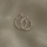 Handmade 925 recycled silver earrings from Basel, showcasing unique, ethical, and sustainable jewelry craftsmanship.