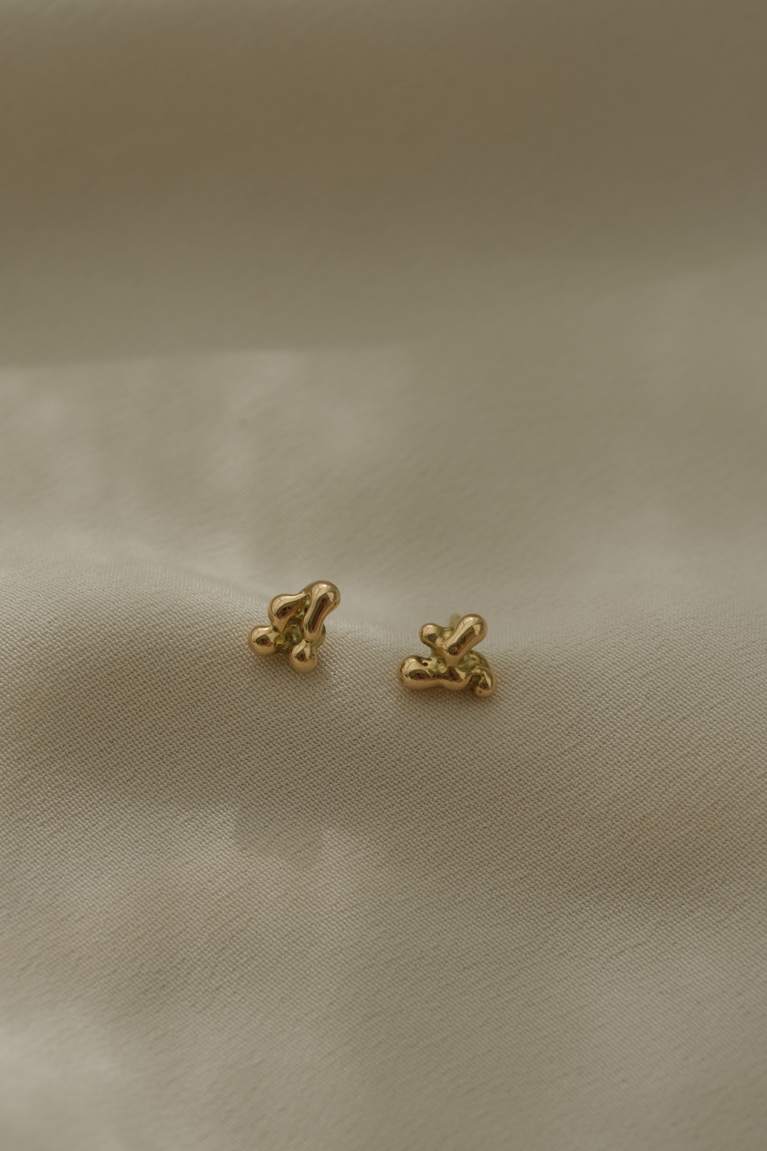 Handmade ethical and sustainable jewelry earrings in 18k recycled gold, designed in Basel, Switzerland.