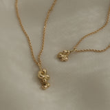 DROP 03 necklace two in recycled yellow gold, showcasing unique handmade design from Basel, Switzerland.