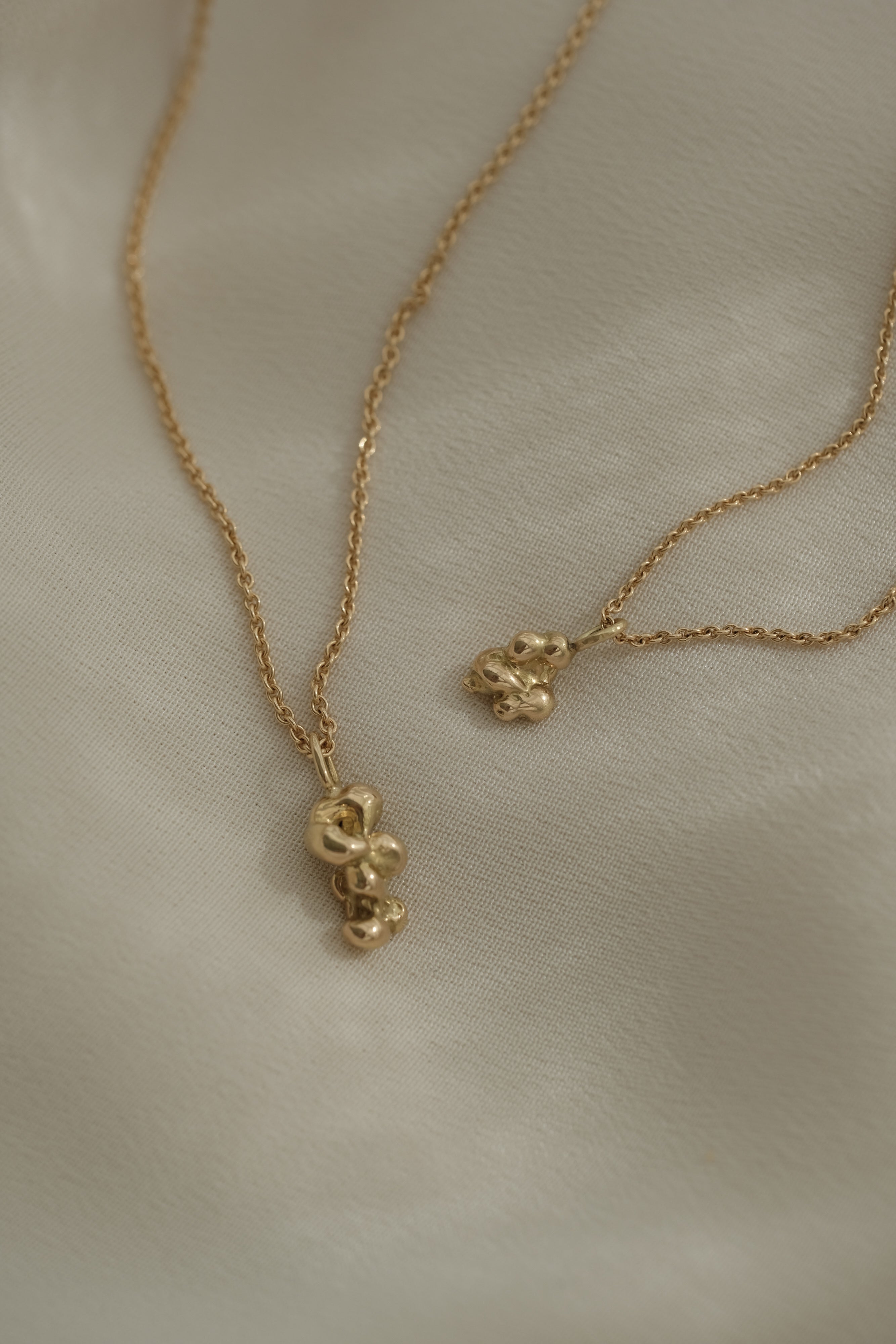 DROP 03 necklace two in recycled yellow gold, showcasing unique handmade design from Basel, Switzerland.