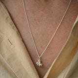 Handmade DROP 03 necklace in 925 recycled silver, showcasing unique design and satin finish, worn on a model.