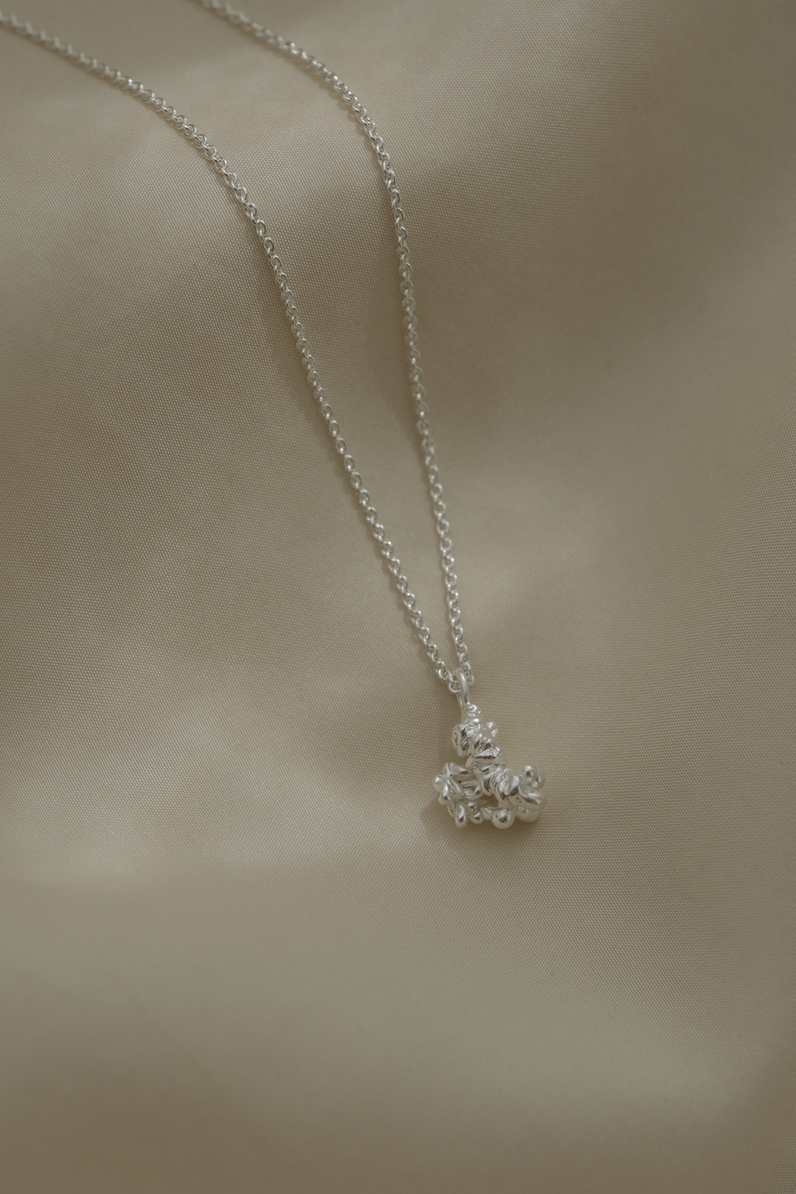 DROP 03 necklace in recycled silver, handmade in Basel, Switzerland, featuring ethical and unique jewelry design.