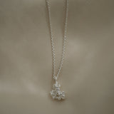 DROP 03 necklace in recycled silver, handmade in Basel, showcasing unique ethical jewelry with satin finish.