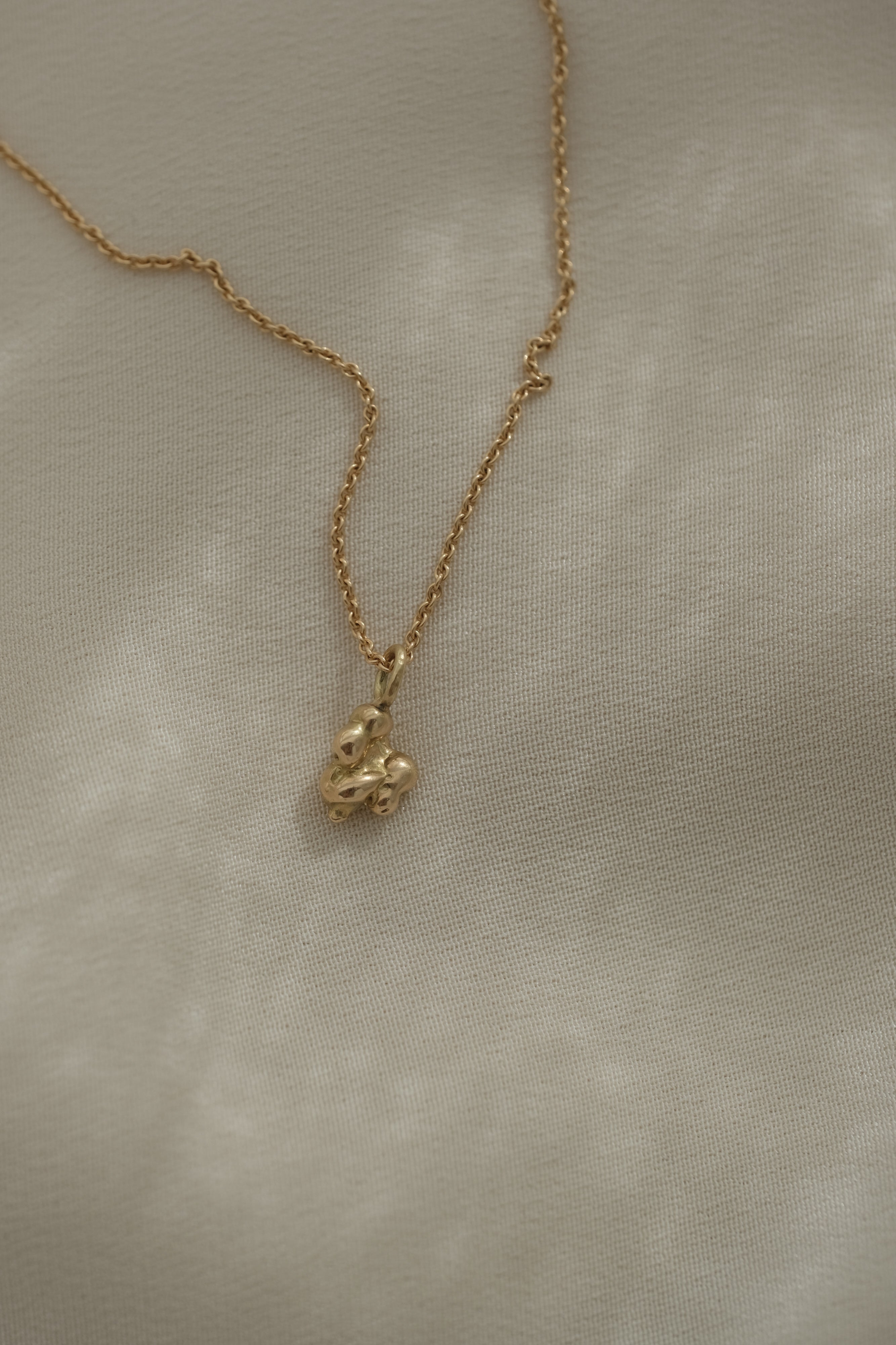 DROP 03 necklace in 18k recycled yellow gold, handmade in Basel, featuring unique ethical and sustainable design.