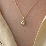 Handmade ethical necklace in 18k recycled gold, featuring unique pendant, designed in Basel, Switzerland.