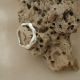 Handmade unique ring in recycled silver on natural stone, showcasing ethical and sustainable jewelry from Basel, Switzerland.