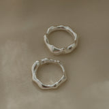 Handmade DROP 03 four rings in 925 recycled silver, showcasing unique, ethical design from Basel, Switzerland.