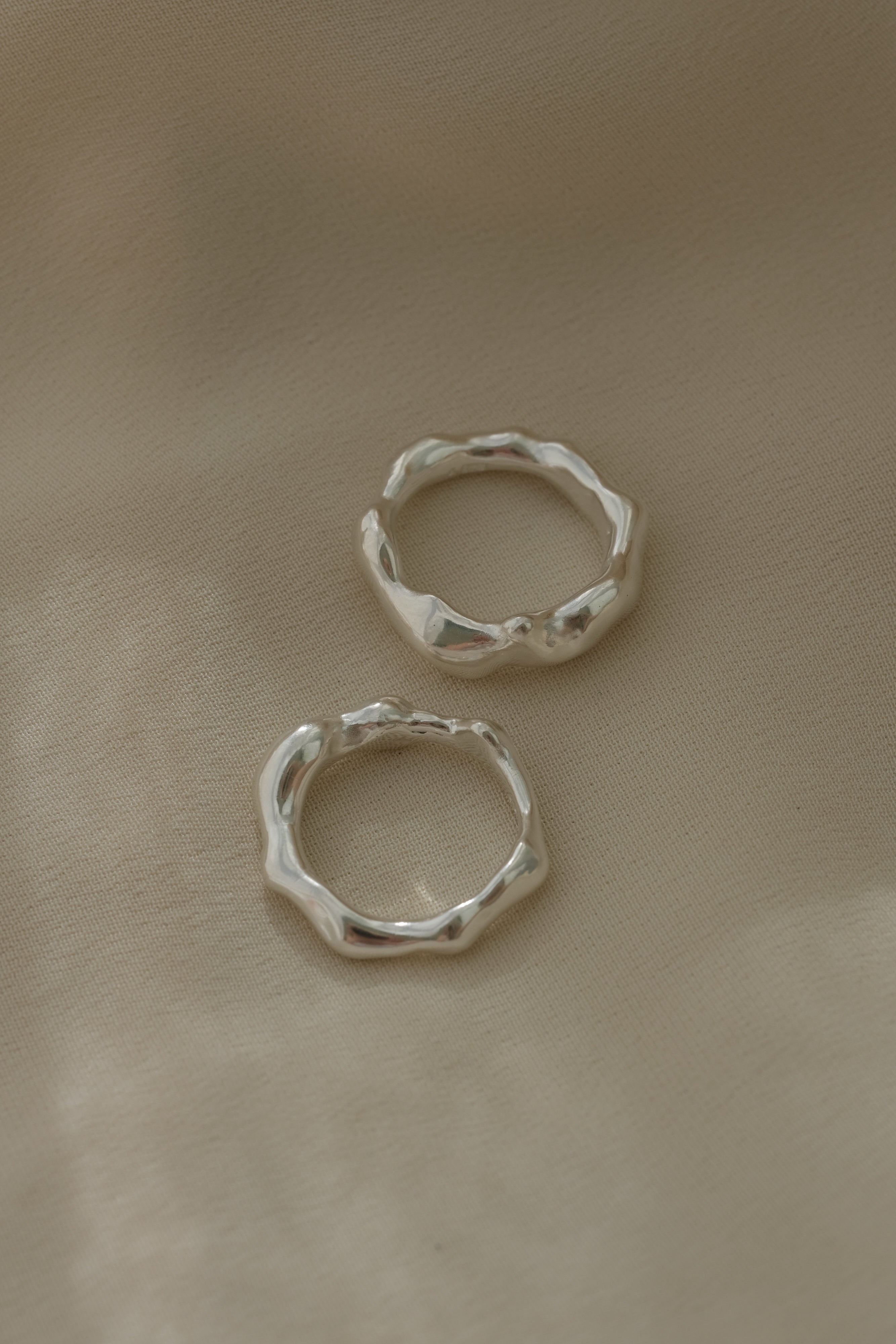 Handmade DROP 03 four rings in 925 recycled silver, showcasing unique, ethical design from Basel, Switzerland.