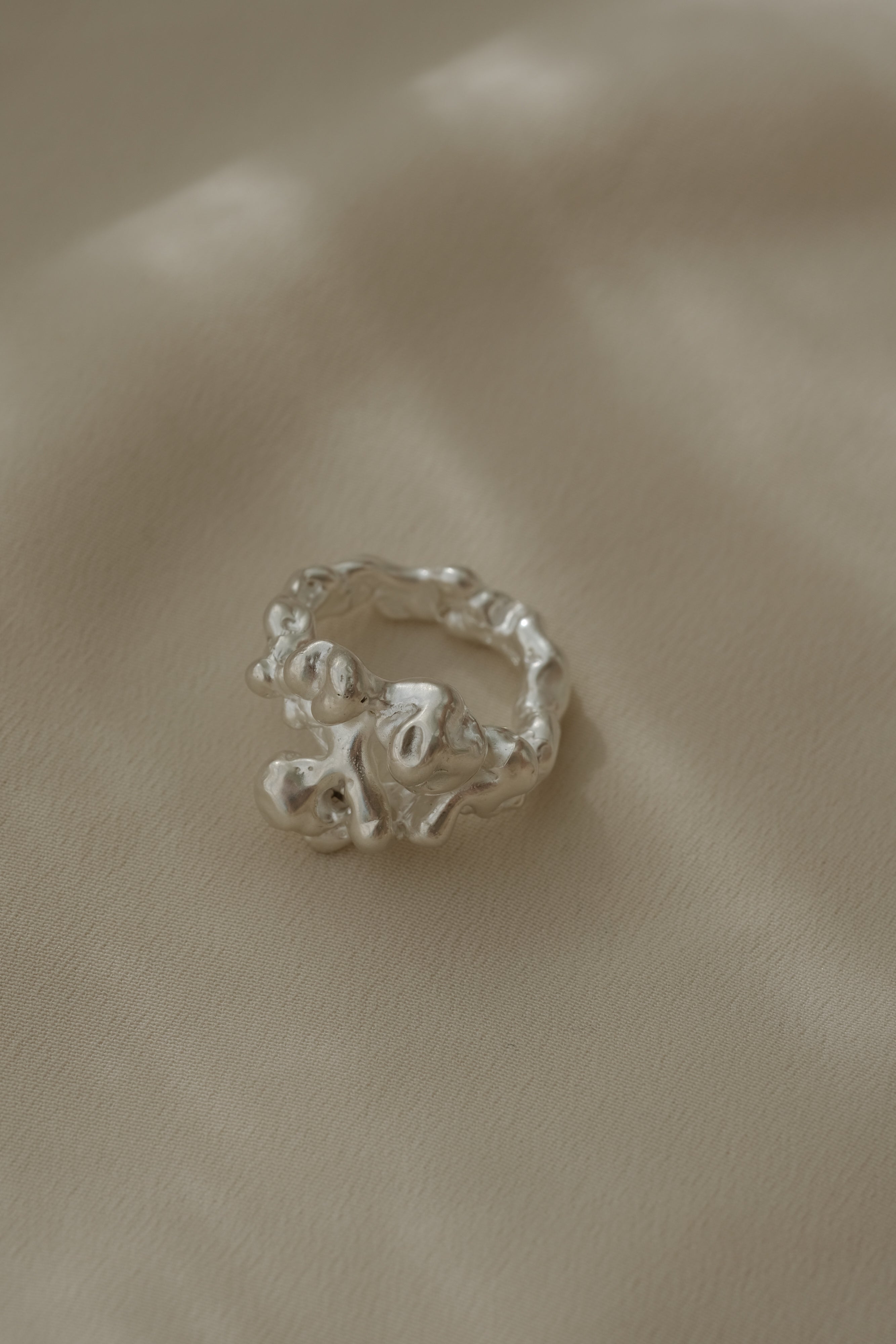 DROP 03 ring in 925 recycled silver showcasing handmade, unique design from Basel, Switzerland.