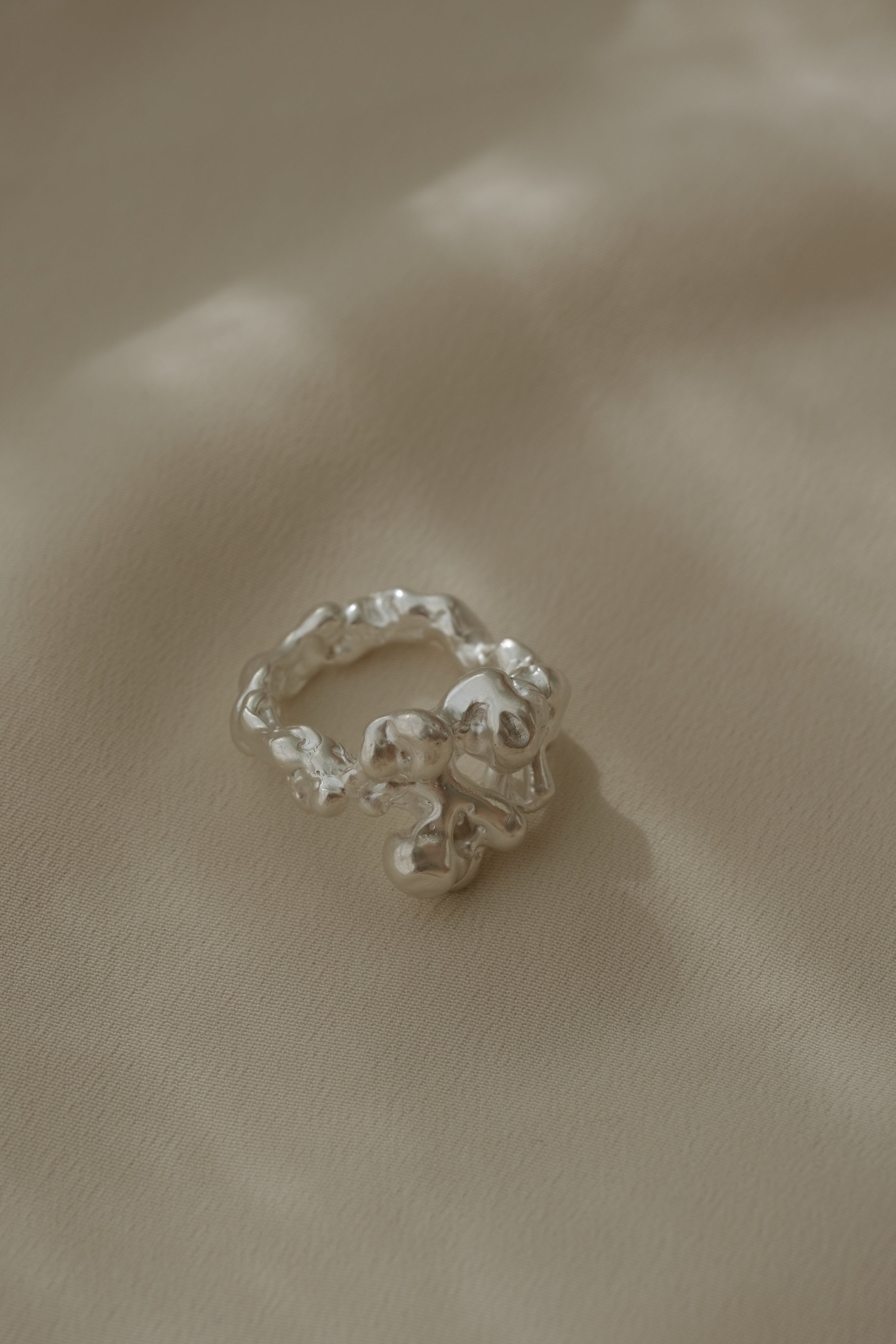 DROP 03 ring one in 925 recycled silver, handmade in Basel, showcasing unique, ethical, and sustainable jewelry.