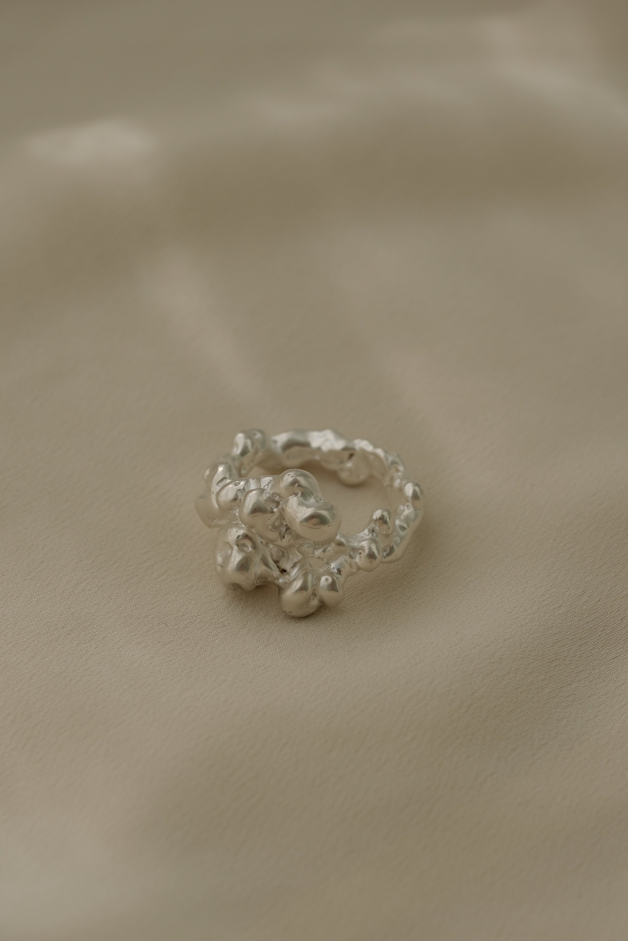 DROP 03 ring in recycled silver, handmade in Basel, Switzerland. Unique ethical jewelry with a satin finish.