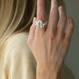 A woman wearing a handmade DROP 03 ring crafted from 925 recycled silver, showcasing unique, ethical jewelry.