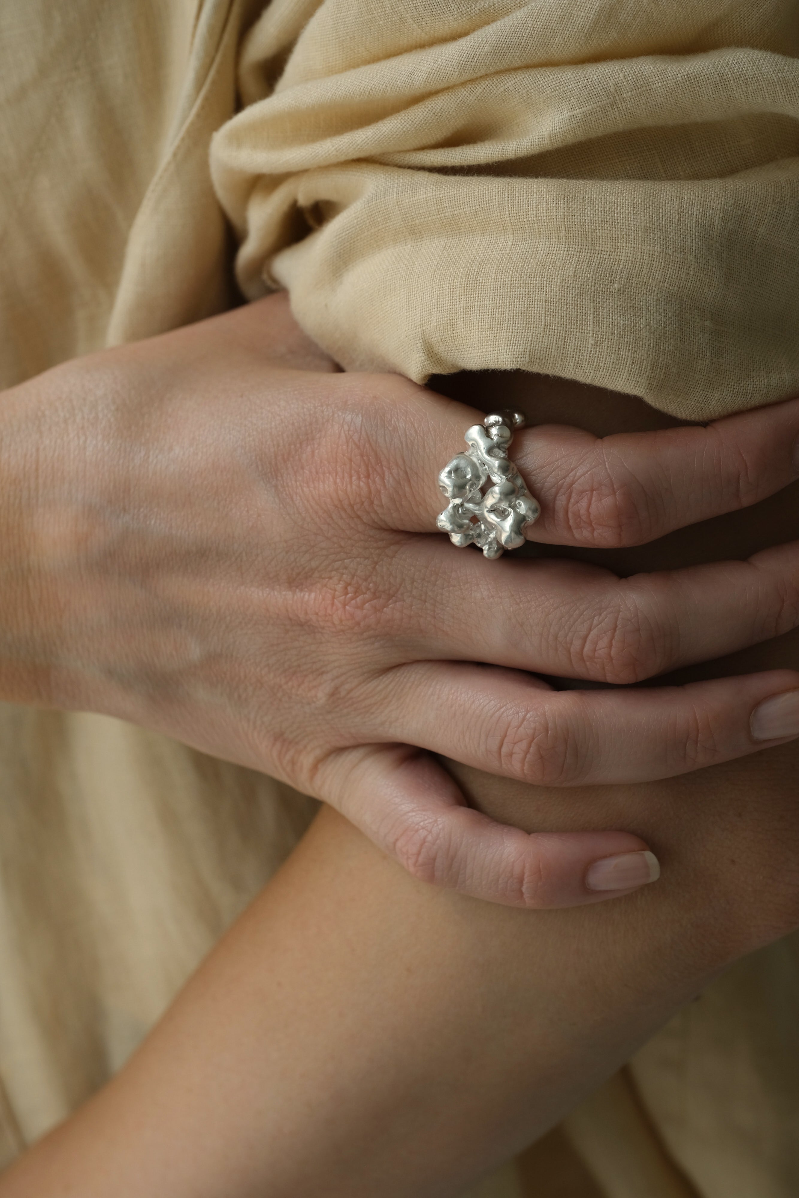 Handmade 925 recycled silver ring showcased on a hand, highlighting unique and sustainable jewelry design from Basel, Switzerland.