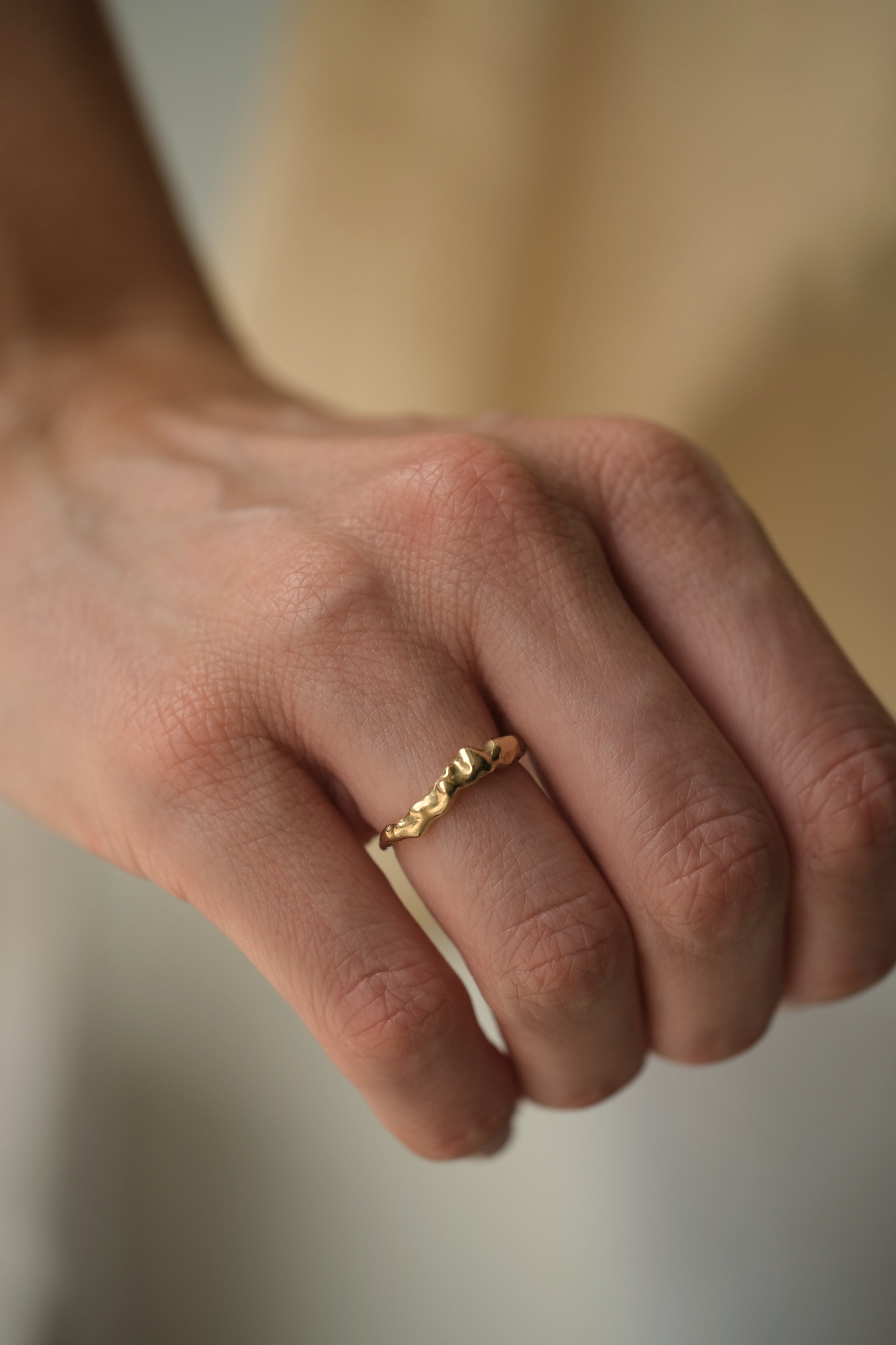 Handmade DROP 03 ring in 18k recycled yellow gold, showcasing ethical and sustainable jewelry crafted in Basel, Switzerland.