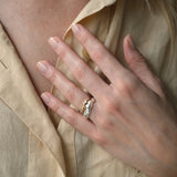 Hand wearing DROP 03 ring made of sustainable 925 recycled silver, showcasing unique design, handmade in Basel, Switzerland.
