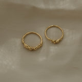 Unique handmade rings crafted from recycled 18k yellow gold, showcasing ethical and sustainable jewelry from Basel, Switzerland.