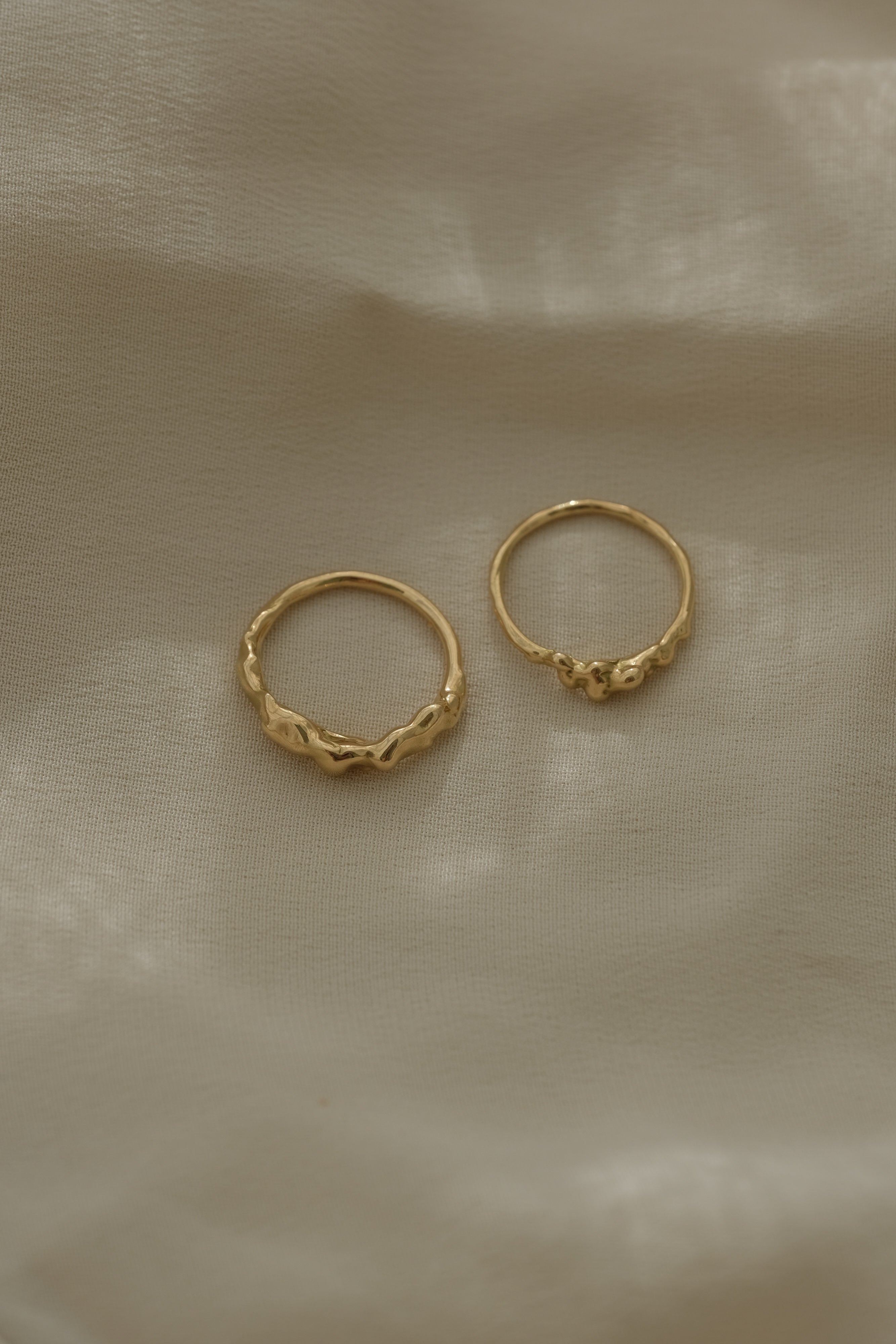Unique handmade rings crafted from recycled 18k yellow gold, showcasing ethical and sustainable jewelry from Basel, Switzerland.