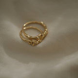 DROP 03 two interlinked rings in recycled yellow gold, showcasing ethical and sustainable jewelry handmade in Basel, Switzerland.