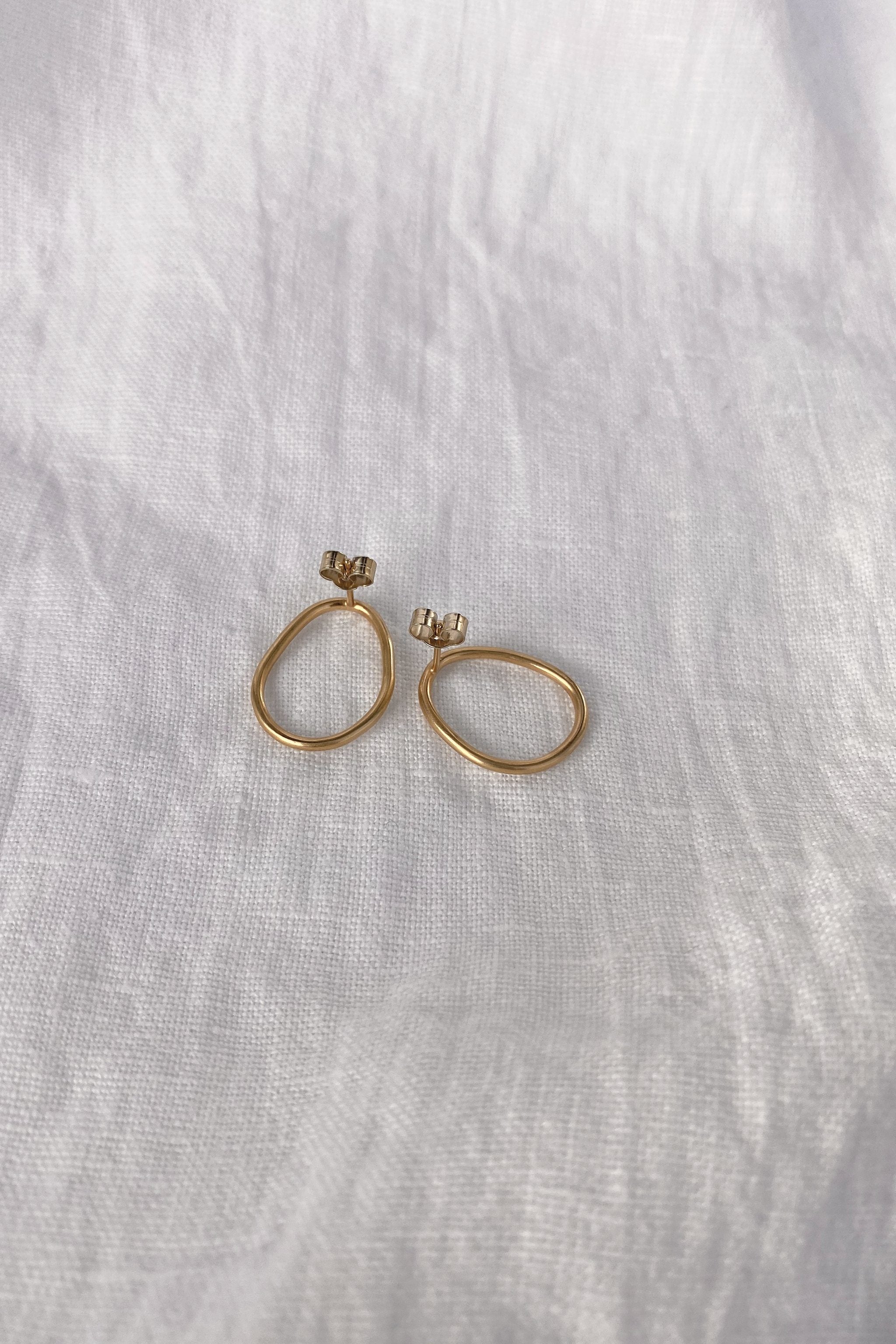 Handmade LOON small earrings in 18k gold-plated recycled silver, showcasing a natural semi-shiny finish.