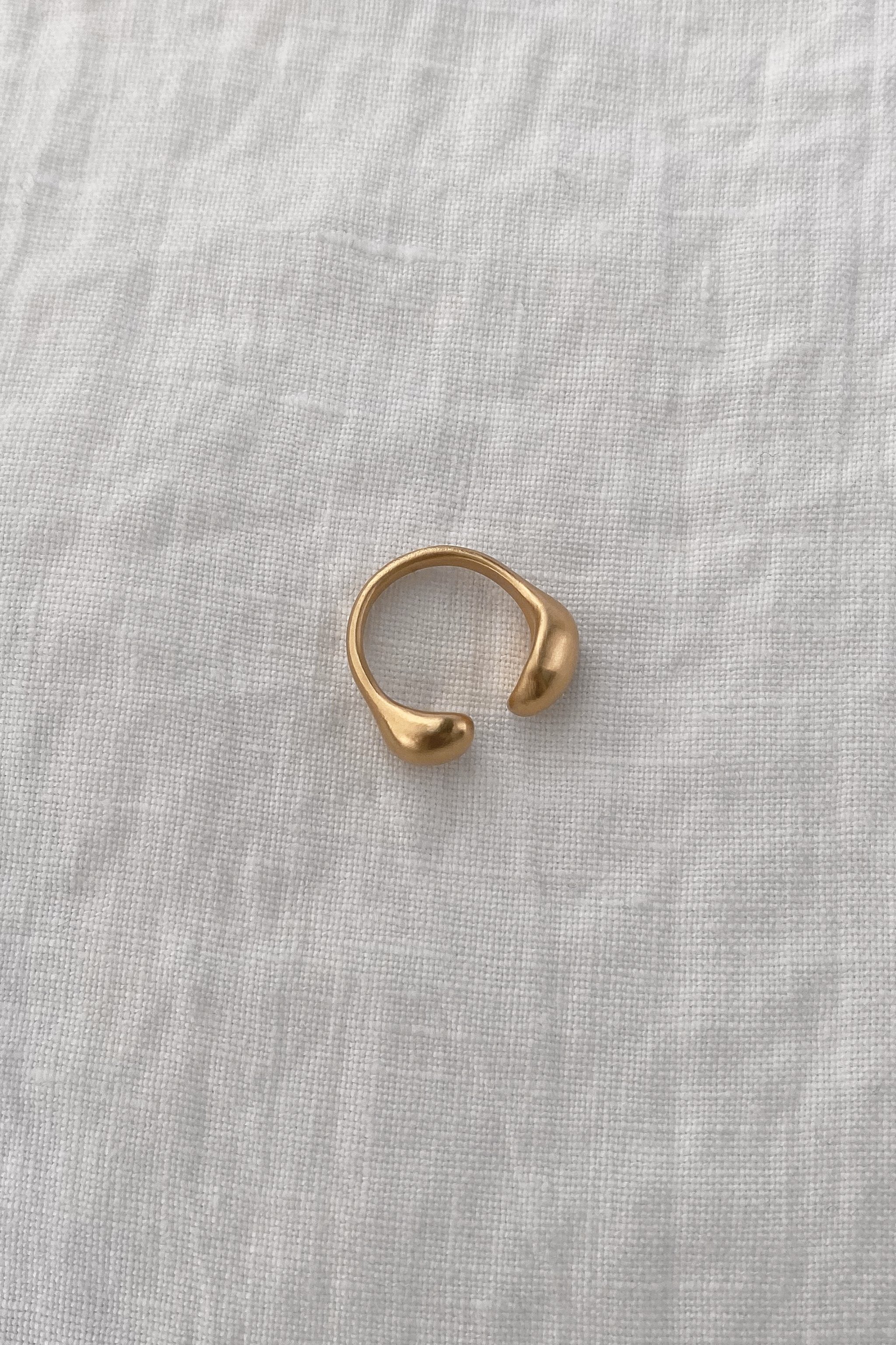 ONOA ring made of 18k gold-plated recycled silver, showcasing a handmade, ethical design.