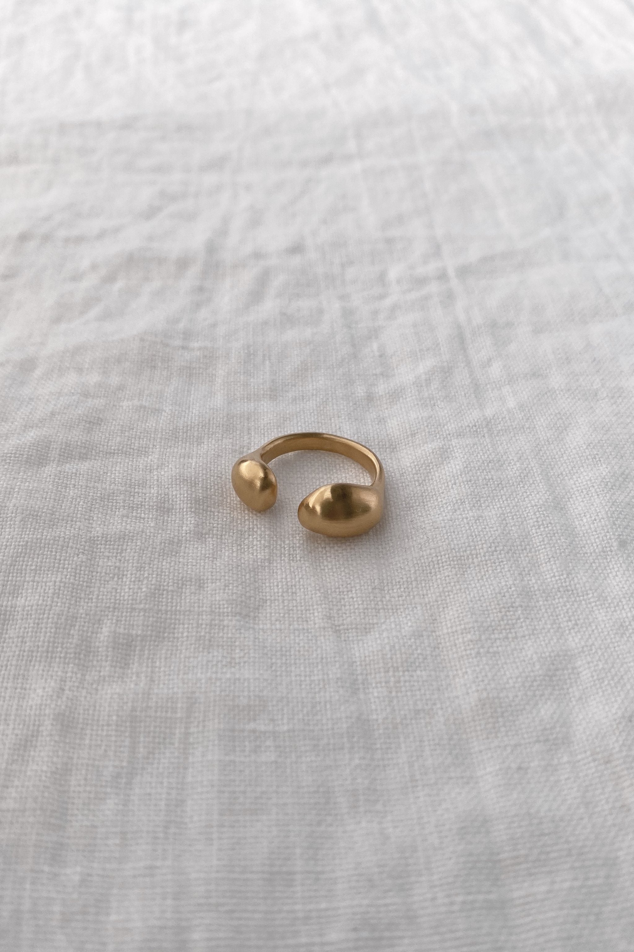 ONOA ring made of 18k gold-plated recycled silver, adjustable sizes, showcasing ethical handmade craftsmanship.