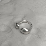 ONOA handmade ring in recycled silver, featuring a semi-matte finish on a textured background, showcasing ethical jewelry.