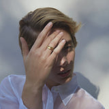 Model wearing YERERA big ring made of sustainable materials, showcasing ethical and handmade jewelry.