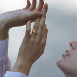 Woman wearing YERERA small ring, showcasing ethical and sustainable jewelry with a handcrafted design.