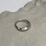 YERERA small handmade ring in recycled silver on textured clay surface, highlighting ethical and sustainable jewelry.