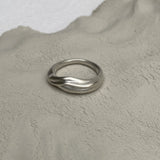 YERERA small ring made from recycled silver, showcasing a semi-matte surface on a textured background, ethical jewelry.