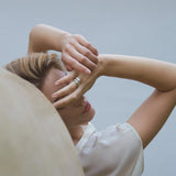 Model wearing YERERA small ring, showcasing ethical handmade jewelry in 18k gold-plated brass or recycled silver.