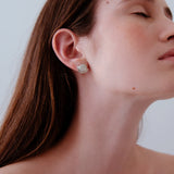 Model wearing MOONLIGHT earrings, handmade ethical jewelry in recycled silver, showcasing sustainable craftsmanship.