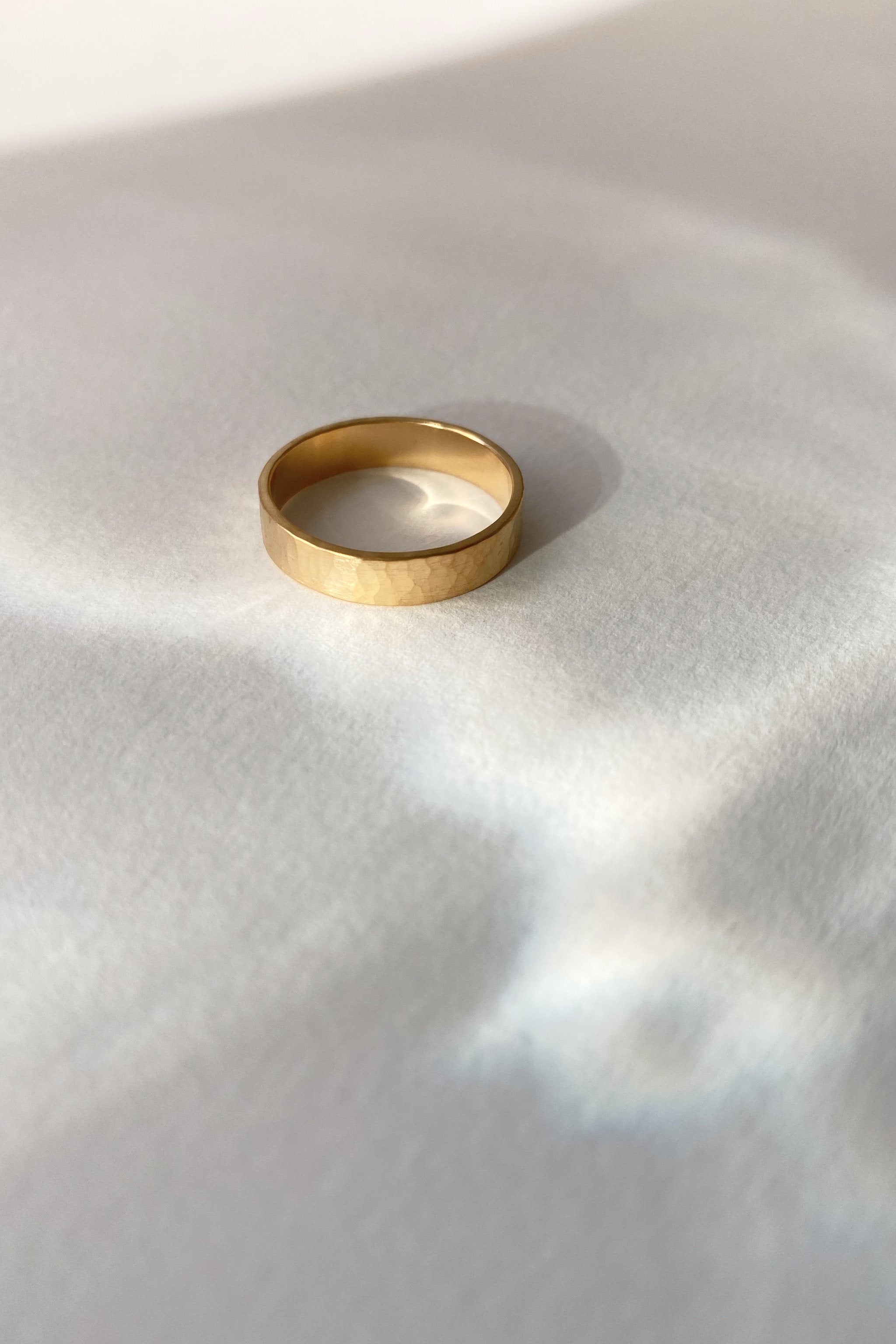 Handmade ISIA big ring in 18k gold-plated brass with a semi-matte hammered finish, showcasing ethical and sustainable jewelry.