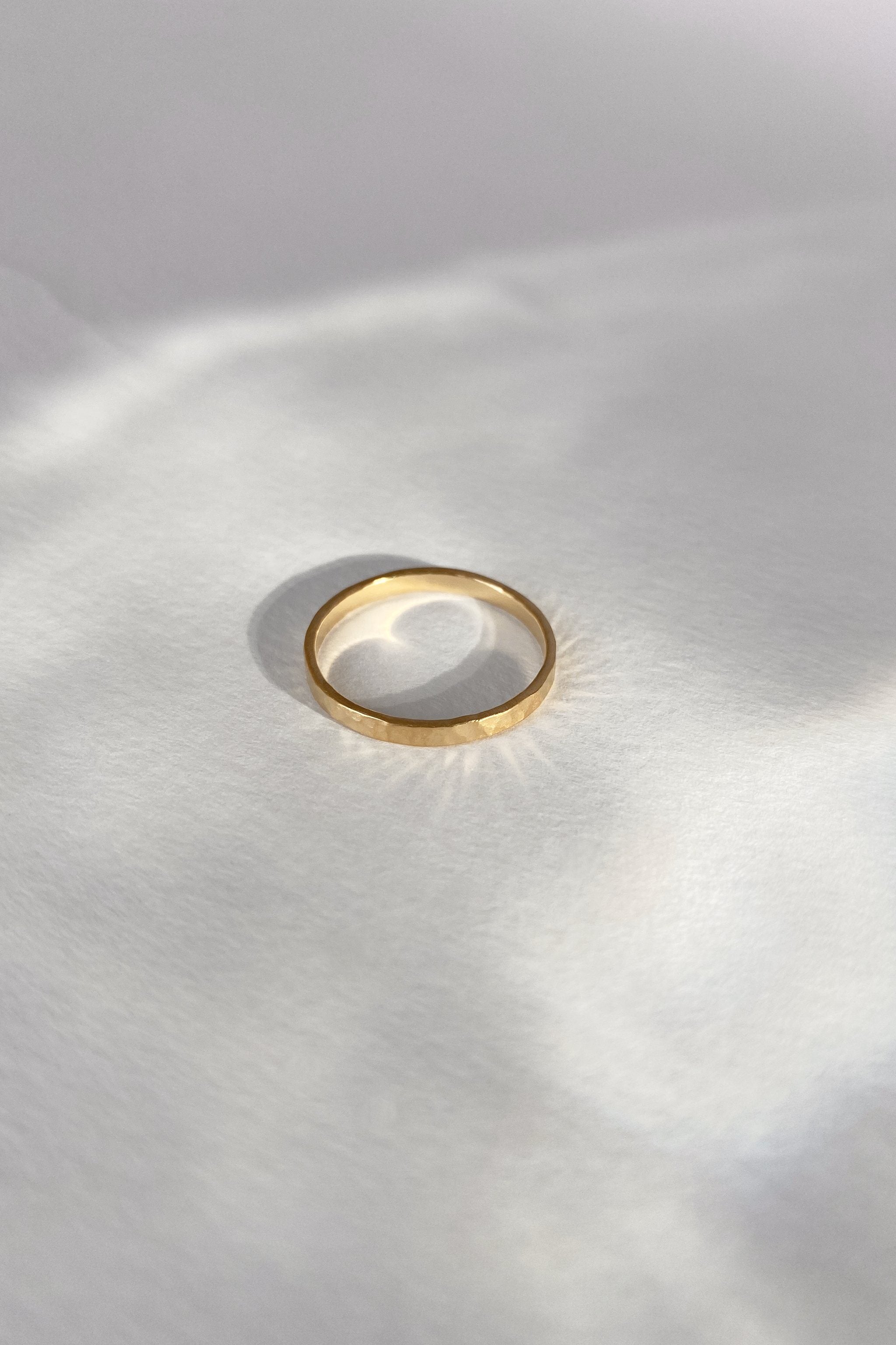 ISIA small ring in 18k gold-plated brass, handmade ethical jewelry with a semi-matte finish, highlighting sustainability.