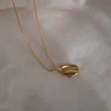 AJUN necklace in 18k gold-plated recycled silver, showcasing ethical, handmade, sustainable jewelry design.