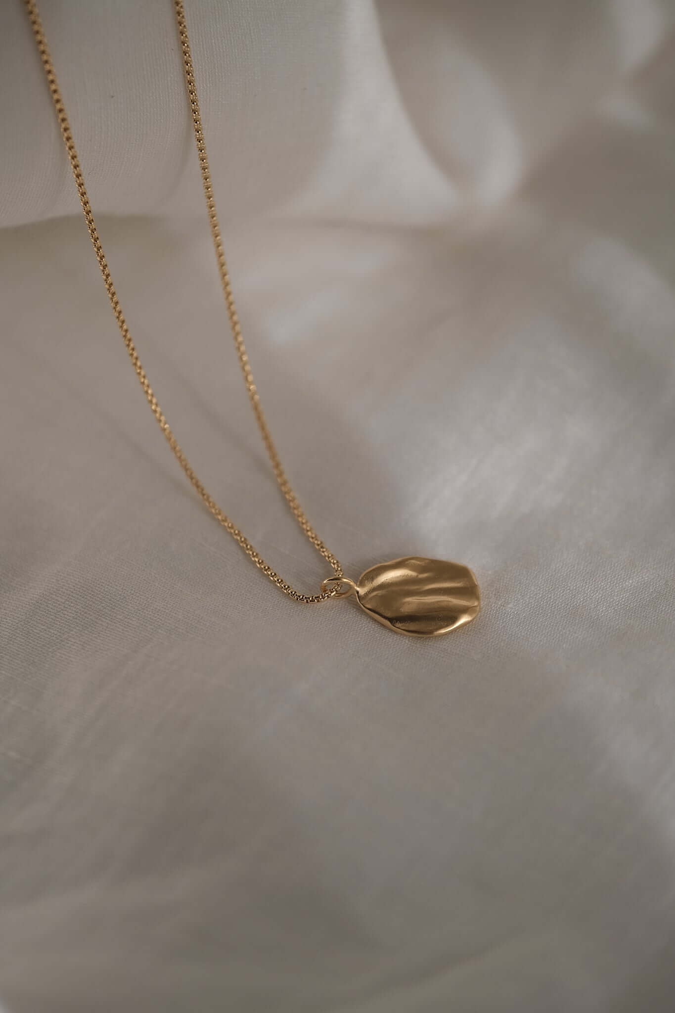 AJUN necklace in 18k gold-plated recycled silver, showcasing ethical, handmade, sustainable jewelry design.