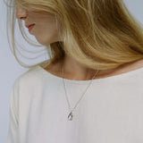 Model wearing AJUN necklace made of recycled silver, showcasing ethical, handmade, and sustainable jewelry design.