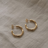 Handmade LUMI big earrings in 18k gold-plated recycled silver, showcasing sustainable and ethical jewelry design.