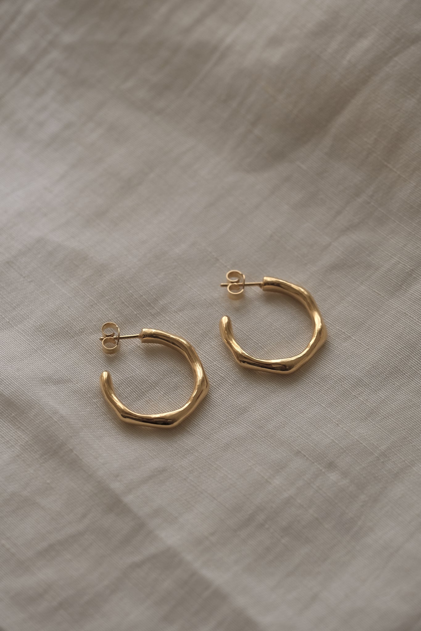 Handmade LUMI big earrings in 18k gold-plated recycled silver, showcasing sustainable and ethical jewelry design.