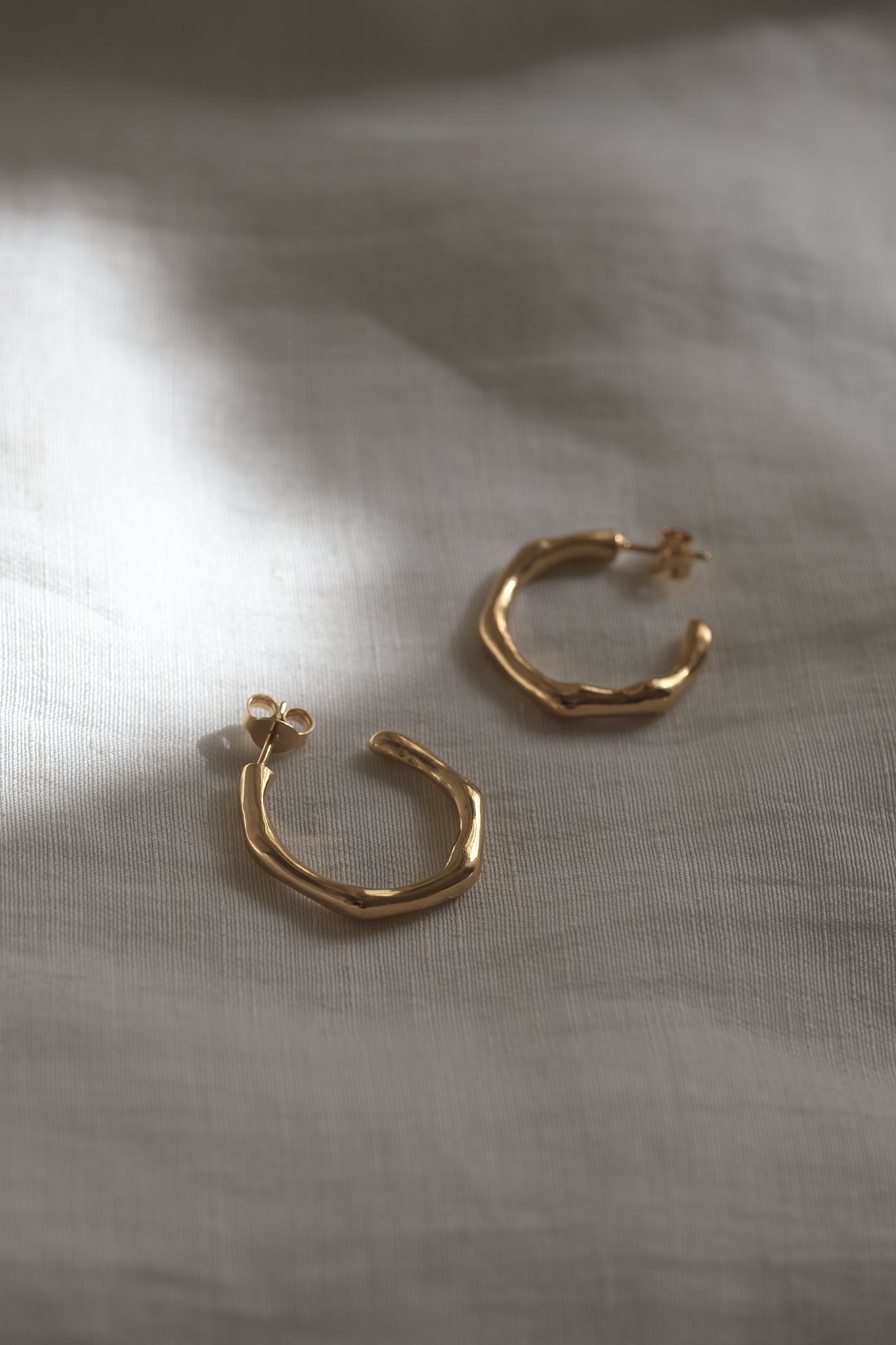 LUMI big earrings, handmade ethical jewelry in 18k recycled gold, showcasing sustainable design with a natural shine.