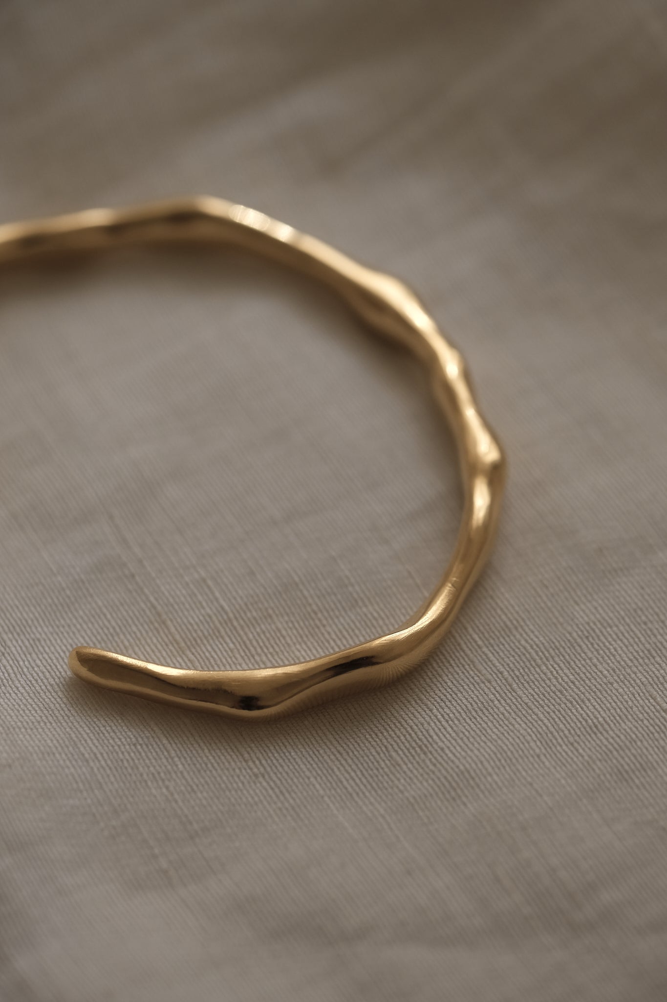 LUMI cuff bracelet in 18k gold-plated recycled silver, handmade, ethical jewelry, sustainable design.