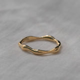 LUMI ring in 18k gold-plated recycled silver, showcasing a natural shiny surface and elegant handmade design.