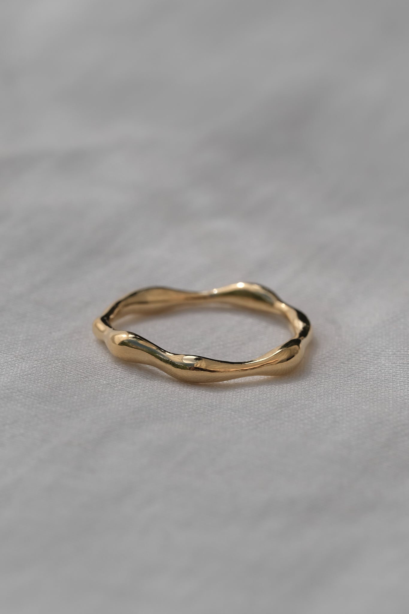 LUMI ring in 18k gold-plated recycled silver, showcasing a natural shiny surface and elegant handmade design.