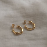 LUMI small handcrafted earrings in 18k recycled gold, organic design, made in Basel, Switzerland.
