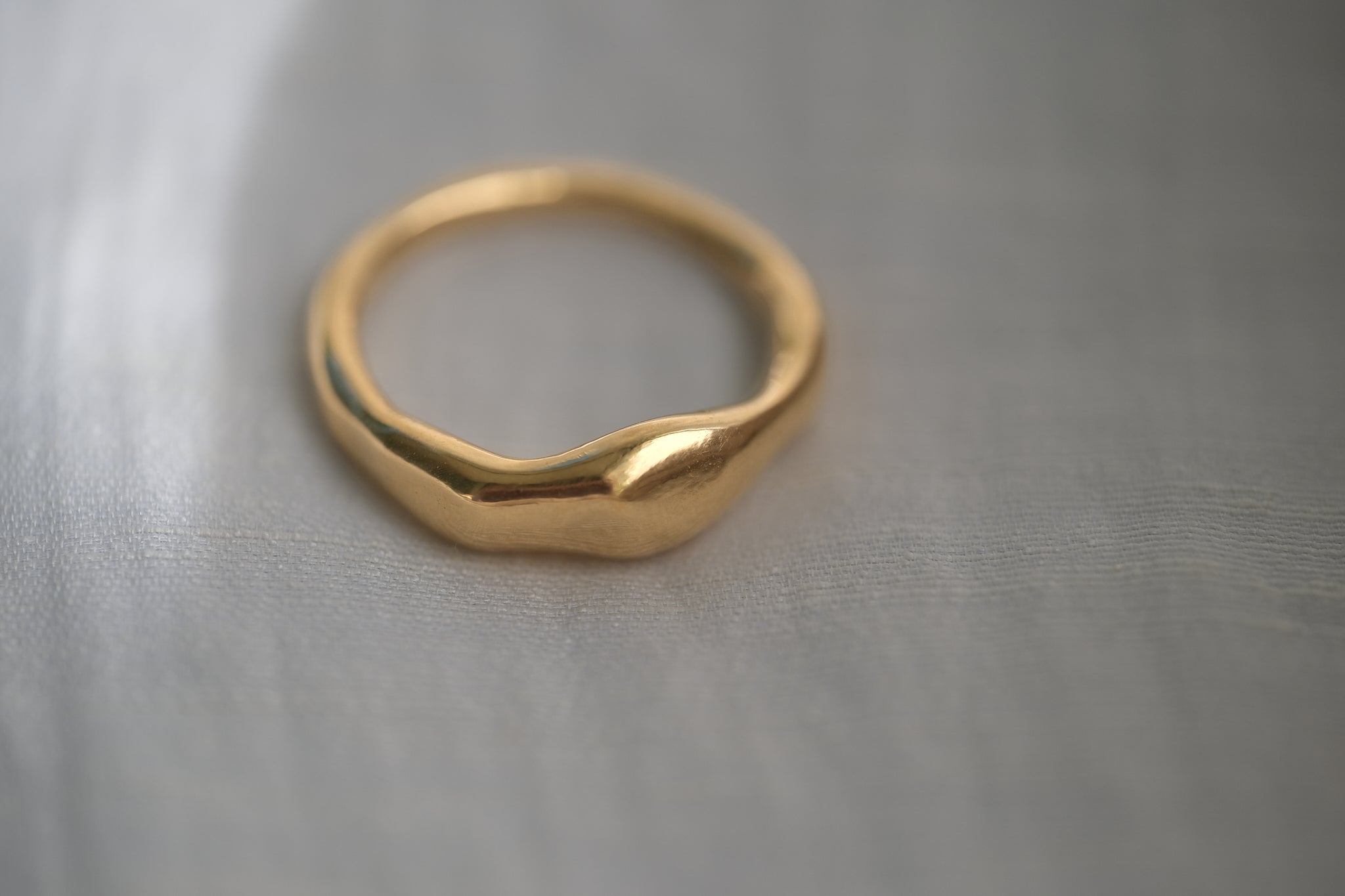 MIRU ring in 18k gold-plated recycled silver, showcasing a natural shiny surface. Ethical handmade jewelry.
