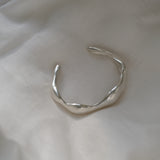 Handmade MOA cuff in recycled silver with a natural shiny surface, representing ethical and sustainable jewelry.