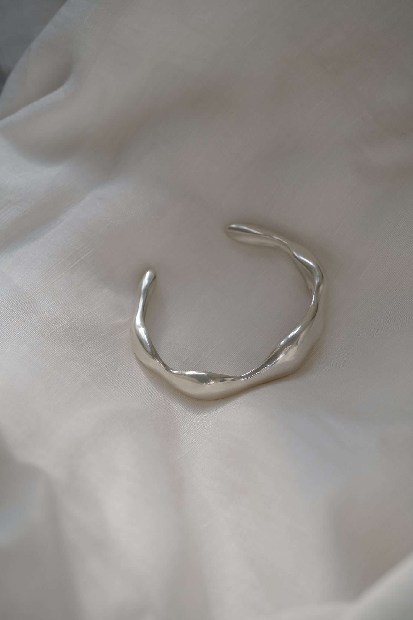 Handmade MOA cuff in recycled silver with a natural shiny surface, representing ethical and sustainable jewelry.