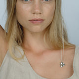 Model showcasing the MOA necklace made of recycled silver, highlighting ethical jewelry and sustainable fashion.