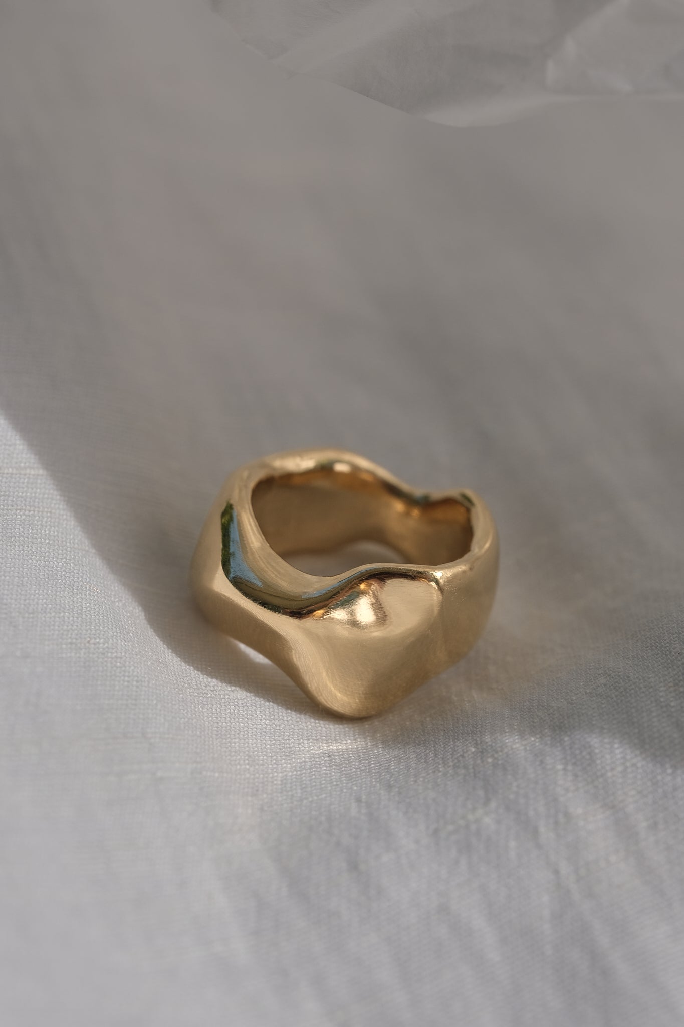 Handmade MOA ring in 18k gold plating, showcasing a natural shiny surface and ethical craftsmanship.
